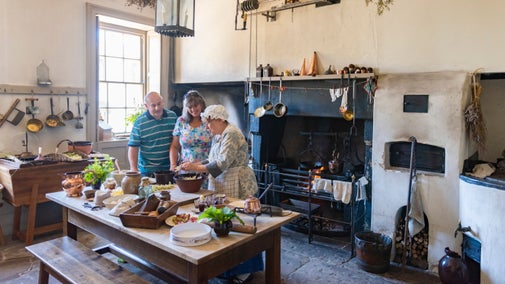 Volunteers making old fashioned desserts in the kitchen at Wordsworth House, Cumbria